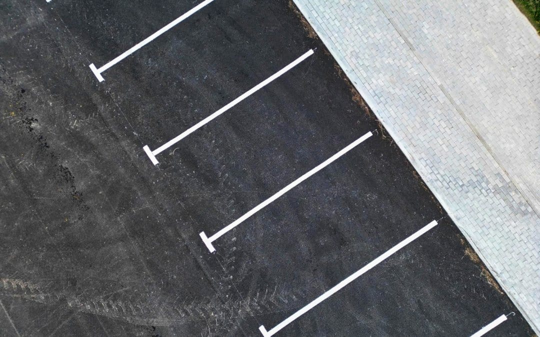 The Small Cracks That Cost Big: Why Parking Lot Repairs Can’t Wait